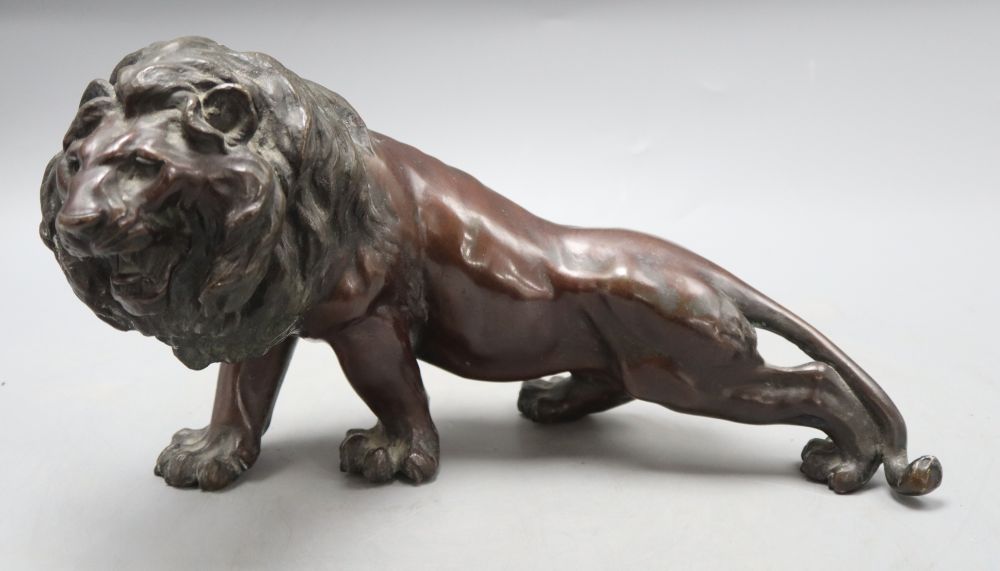 A Japanese bronze lion, length 35cm